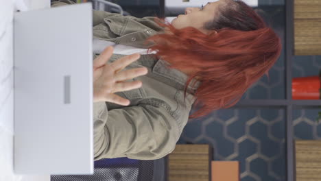 Vertical-video-of-Business-woman-looking-scared-at-laptop.